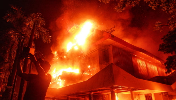 Council building ablaze during protests in Makassar, Indonesia (Image credit: The Guardian)